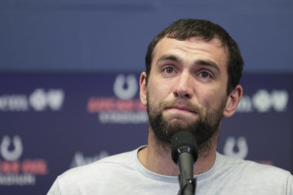 Andrew Luck speaks during a news conference